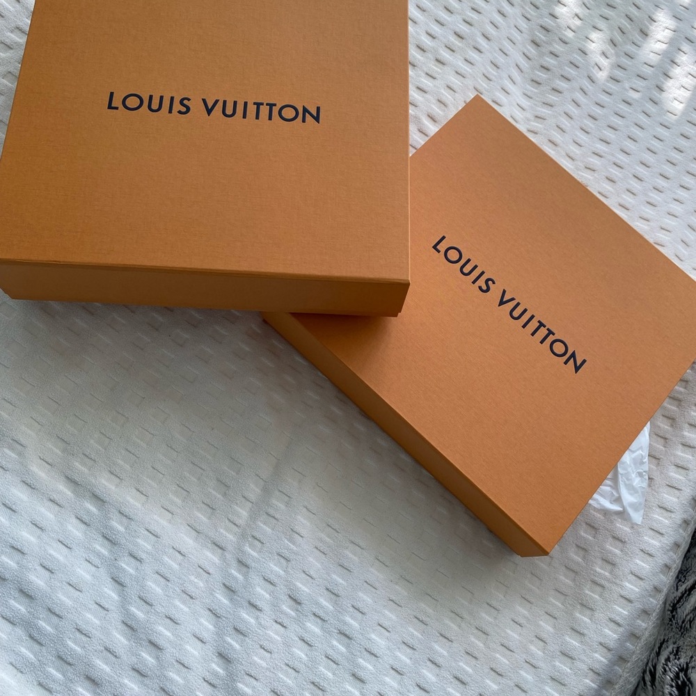 Two Louis Vuitton boxes come with LV ribbon and one still has original tissue